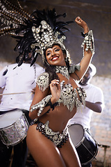 Image showing Carnival, dancing and woman for performance in Brazil, dancer with gemstone outfit and feather head gear outdoor. Music, samba and happiness for event, culture with festival entertainment and talent