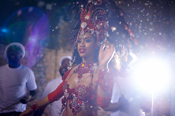 Image showing Samba, woman and dancer with band at festival in rio de janeiro for brazilian carnival with feather costume or smile. Person, face or night with dancing, fashion or light for culture or outdoor event