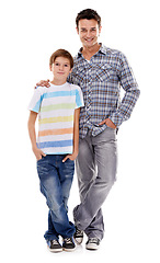 Image showing Happy dad, portrait and hug with kid in fashion for family or bonding on a white studio background. Father, son or child with smile in casual clothing, support or trust for parenthood or childhood