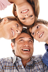 Image showing Face of mother, father and children on a white background for bonding, relationship and love. Family, happy and low angle of isolated mom, dad and kids for support, care and together in studio