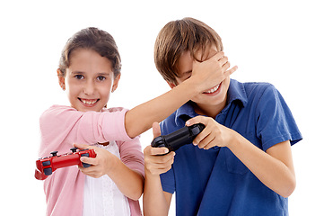 Image showing Kids, gaming and controller for siblings in studio, portrait and cover eyes by white background. Girl, boy and family children with video game, press and contest with strategy, cheating or playing