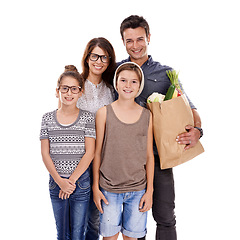 Image showing Happy family, portrait and bag with groceries for natural sustainability in fashion on a white studio background. Mother, father and children with smile for food shopping in casual clothing on mockup