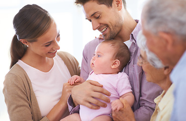 Image showing Family, grandparents and parents with baby for happiness at home, people bonding with love and relationship. Support, trust and smile for pride with generations, childhood and connect with infant