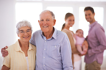 Image showing Senior, couple and happy portrait in home with hug, family and commitment to marriage in living room. Elderly, man and woman with face, smile and embrace in lounge of house for romance, love or care