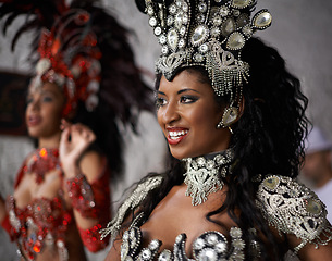 Image showing Happy woman, samba dancer and traditional costume for performance at carnival or festival in fashion. Face of young female person or exotic performer with smile for dancing at party or concert in Rio