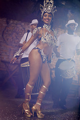 Image showing Woman, dancing and samba for carnival and music festival or street performance with costume at night. Portrait of dancer with drummer or band for event, celebration and culture in Rio de Janeiro