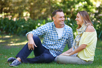 Image showing Relax, chat and couple with smile on grass for summer romance, trees and fun outdoor date. Love, mature man and happy woman in garden with morning sunshine, talking and marriage bonding in nature.