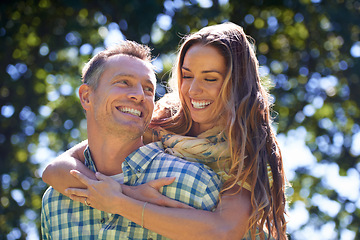 Image showing Love, hug and couple with smile in park for summer romance, trees and fun outdoor date. Laughing, mature man and happy woman in garden with morning sunshine, embrace and marriage bonding in nature.