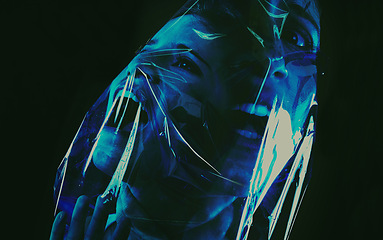 Image showing Scary, face and woman with plastic or bag in horror, drama or death in dark background of studio. Suffocating, murder and girl with fear from crime, victim and trapped in trash, garbage or pollution