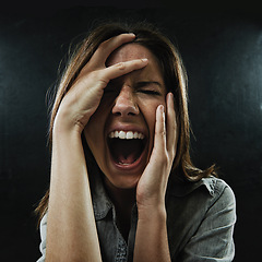 Image showing Face, stress and horror with woman screaming in studio on black background for reaction to fear. Phobia, anxiety and mental health with scared young person in dark for drama, nightmare or terror