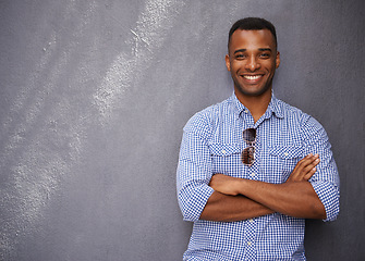 Image showing Man, smile and fashion or style in portrait by wall background, cool outfit and mockup space. Happy black male person, university student and outdoors for aesthetic, confident and trendy clothes