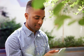 Image showing Man, phone and reading communication outdoor with notification, text message and mobile chat on sidewalk. African person, face and smile with smartphone for internet conversation or social media post