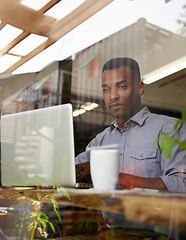 Image showing African man, laptop and writing for reading, search and typing for work with coffee in workspace. Self-employed, freelance and male person with computer for internet, browsing and communication