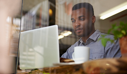 Image showing Black man, laptop and typing with reading for search, remote work or writing with coffee in cafe. Hot drink, freelance writer and male person with computer for internet, browsing and communication