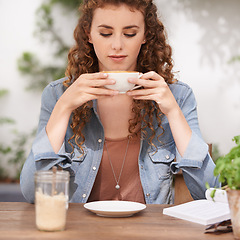 Image showing Cafe, woman and drinking coffee at table to relax, peace or calm at breakfast for energy in the morning. Latte, cup and student with espresso in shop, beverage or hot healthy cappuccino at restaurant