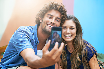 Image showing Couple, selfie and smiling with sunshine for picture, happy and post for social media on summer vacation. Man, woman and together for love on holiday with romance and commitment for memories