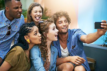 Image showing Funny, face and group of students for selfie at university campus for profile picture update or social media post. Men, women and happy friends with technology for memory, diversity and college fun