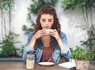 Image showing Female person, thinking and coffee at cafe in outdoor, fashion and day dream with cup and doubt. Woman, bistro and relaxation with cappuccino, journalist and contemplate at breakfast or lunch