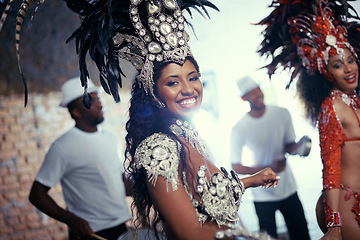 Image showing Smile, carnival or happy woman in costume or portrait for celebration, music culture or band in Brazil. Event, night or proud girl dancer with fashion at festival, parade or show in Rio de Janeiro