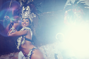 Image showing Smile, festival or happy woman in costume or portrait for celebration, music culture or band in Brazil. Night event, party or girl dancer with energy at carnival, parade or fun show in Rio de Janeiro