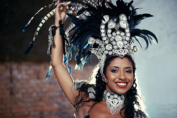 Image showing Portrait, samba dancer and black woman with headdress for carnival, festival or parade on urban background in Rio de Janeiro. Brazilian performer, female person and closeup in costume for performance