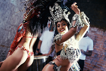 Image showing Party, carnival or women in costume dancing for celebration, music culture or samba in Brazil. Girl friends, smile or dancers with rhythm or fashion at festival, parade or fun show in Rio de Janeiro