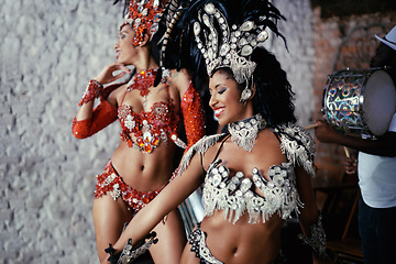 Image showing Samba, carnival and women in costume together for celebration, music culture and happy band in Brazil. Dance, party and girl friends with smile at festival, parade or stage show in Rio de Janeiro