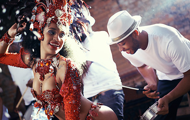 Image showing Samba, drummer or happy woman in carnival for celebration, music culture or band in Brazil. Event performance, night or girl dancer with smile at festival, parade or fun live show in Rio de Janeiro