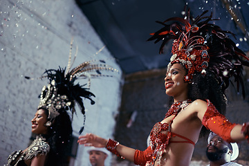 Image showing Night, carnival or women in costume dancing for celebration, music culture or samba in Brazil. Girl friends, party or dancers with rhythm or fashion at festival, parade or show in Rio de Janeiro