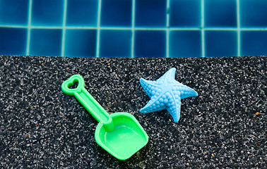 Image showing Plastic starfish and spade