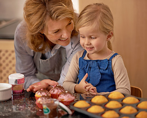 Image showing Grandmother, child and baking cupcakes in kitchen with icing decorations or learning creativity, bonding or teamwork. Female person, girl and sweet treats or teaching with ingredients, snack or fun