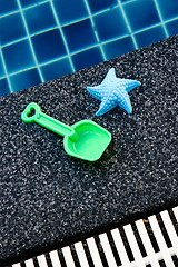 Image showing Plastic starfish and spade