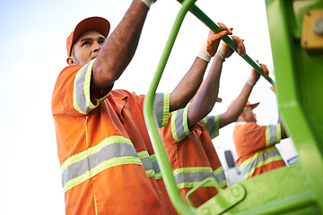 Image showing Industry, waste management and garbage truck with men in uniform cleaning outdoor on city street. Job, service and male people working with rubbish for sanitation, maintenance or collection of dirt.