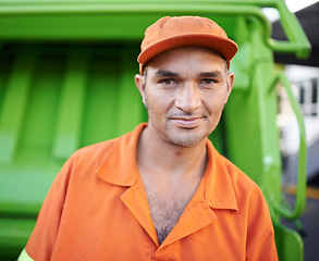 Image showing Portrait, man and working with garbage truck for trash, outdoor and Cape Town. Male person, adult and employee with orange uniform for service in urban city, waste and recycling in environment