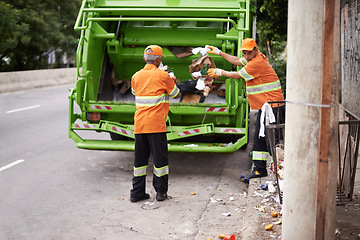 Image showing Men, garbage truck and city sidewalk for collection service for public pollution for recycling, waste management or trash. Community worker, teamwork and plastic in New York for junk, refuse or dirt