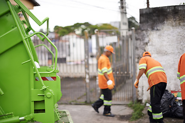 Image showing Garbage truck, trash and people with collection service on street in city for public environment cleaning. Junk, recycling and men working with waste or dirt for road sanitation with transport.