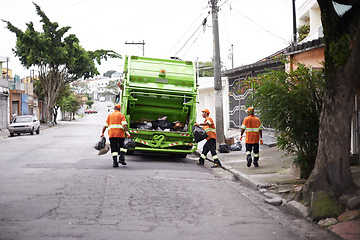 Image showing Garbage truck, waste and men with collection service on street in city for public environment cleaning. Junk, recycling and male people working with dirt or trash for road sanitation with transport.