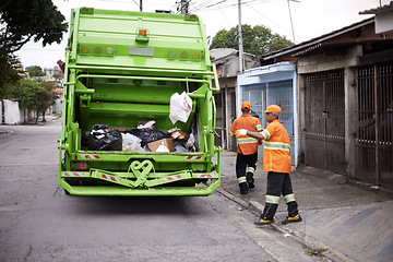 Image showing Garbage truck, dirt and people with collection service on street in city for public environment cleaning. Junk, recycling and men working with waste or trash for road sanitation with transport.