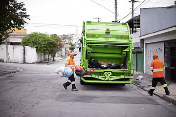 Image showing Garbage truck, junk and men with collection service on street in city for public environment cleaning. Dirt, recycling and male people working with waste or trash for road sanitation with transport.