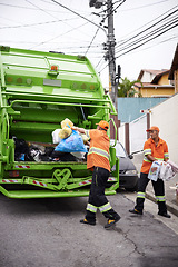 Image showing Garbage truck, dirt and team with collection service on street in city for public environment cleaning. Junk, recycling and men working with waste or trash for road sanitation with transport.