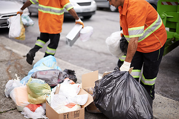 Image showing Worker, street and bag of trash in city for cleaning, recycling and waste management with teamwork. Road, pollution and people with garbage for maintenance, service and transportation of dirt