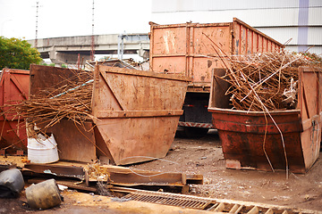 Image showing Recycle, metal and rust on skip in junkyard for sorting, garbage and scrap reuse at landfill site. Steel, iron and industrial bin for truck with urban pollution at waste dump with machine