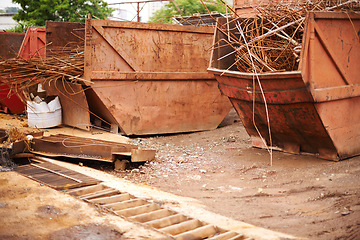 Image showing Recycle, scrap and rust on skip in junkyard for sorting, garbage and metal reuse at landfill site. Steel, iron and industrial bin for truck transport with urban pollution at waste dump with machine