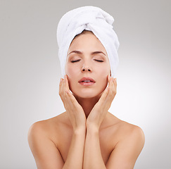 Image showing Beauty, cosmetics and face of woman with towel, natural glow and getting ready in studio. Dermatology, healthy skin and girl on white background with luxury facial, morning routine and skincare.