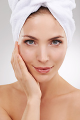 Image showing Cosmetics, skincare and portrait of woman with towel, glow and getting ready in studio. Dermatology, healthy skin and girl on white background with luxury facial, morning routine and natural beauty.