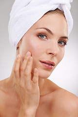 Image showing Dermatology, skincare and portrait of woman with towel, glow and getting ready in studio. Beauty, healthy skin and face of girl on white background with luxury facial, morning routine and cosmetics.