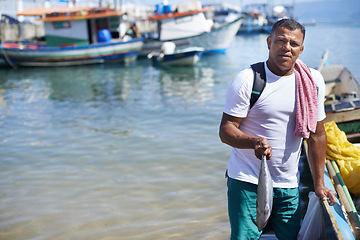 Image showing Portrait, ocean and fisherman with fish by boat in nature outdoor to travel in summer. Person, man and animal by ship at sea, food and fresh catch with serious angler by water in Brazil on mockup