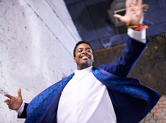 Image showing Happy, dance and black man at club with music, energy and movement in celebration at night. African, person and expression of creativity, rhythm and joy from show of talent for salsa choreography