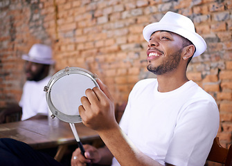 Image showing Band, drums or carnival with a happy man playing an instrument in a festival in Rio de Janeiro. Brazil, smile or party with a male musician, performer or artist banging with sticks to create a beat