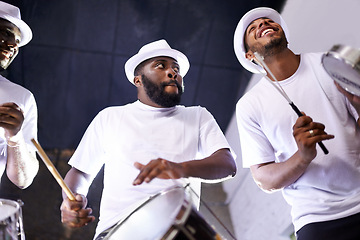 Image showing Band, drums or carnival with a happy people playing an instrument in a festival in Rio de Janeiro. Brazil, show or group of musician, performer or artist banging on a drum to create a beat in party